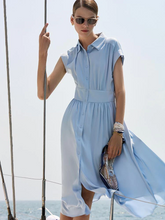 a lady in silk blue shirt dress